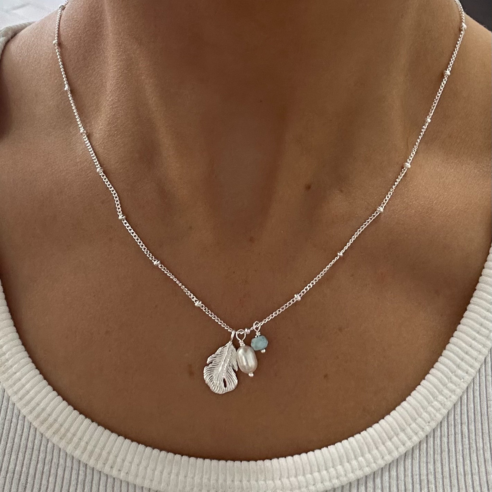 dainty boho feather necklace with small pearl and larimar