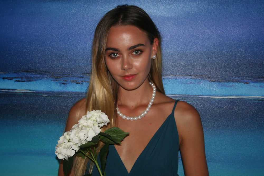 PEARL NECKLACE INDIVIDUALLY HAND KNOTTED ON SILK WITH STERLING SILVER CLASP