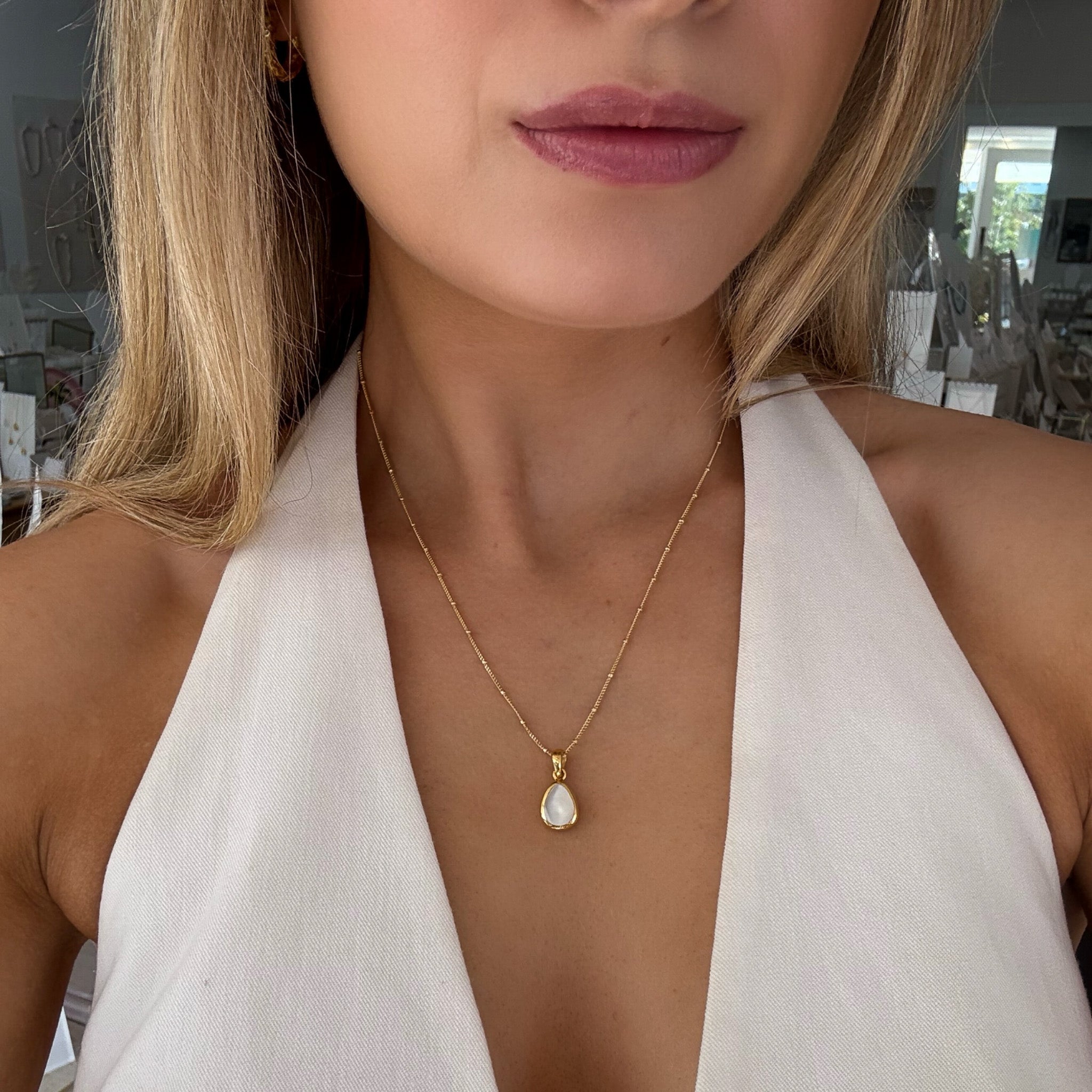 dew drop mother of pearl pendant in gold
