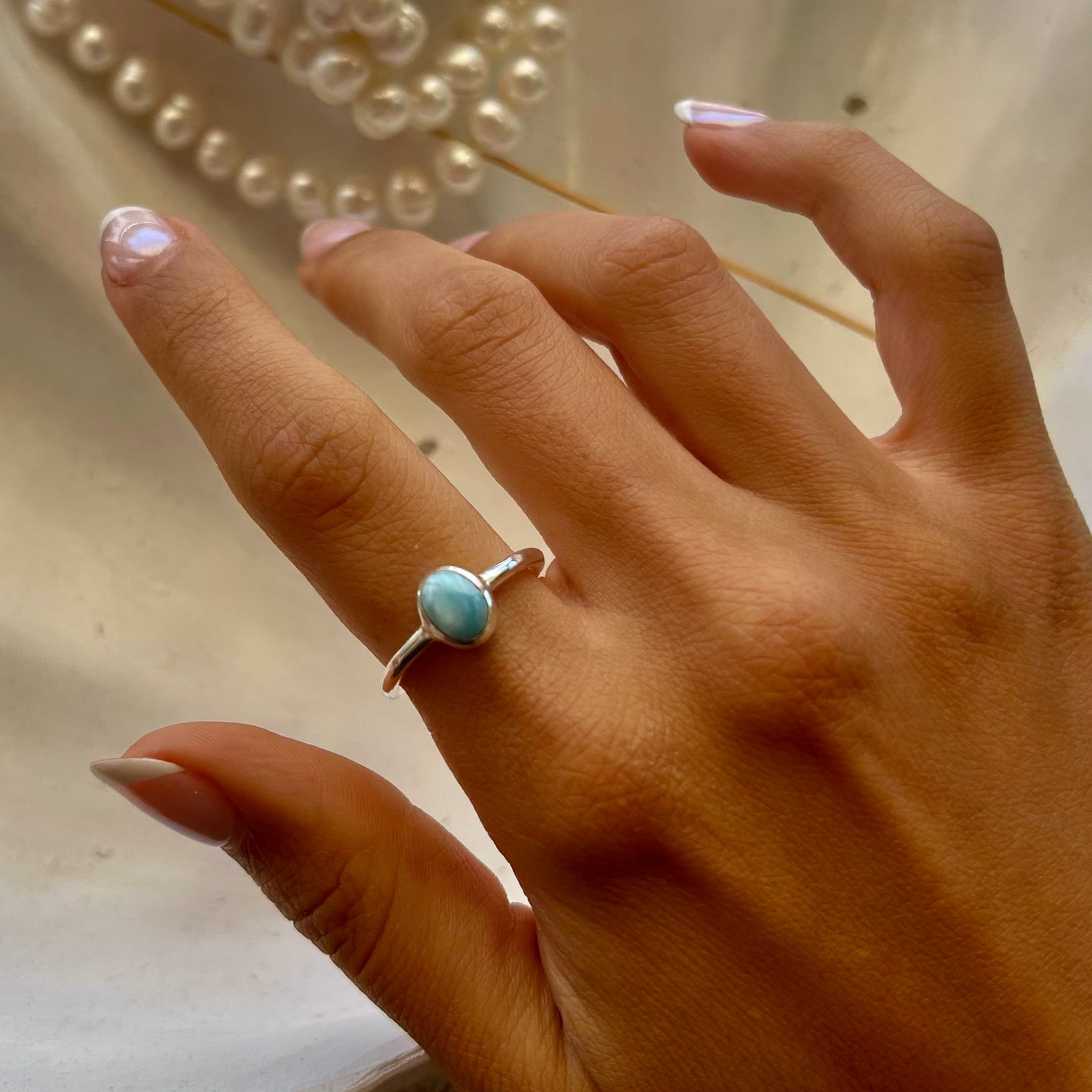 dainty oval shaped larimar ring set in silver