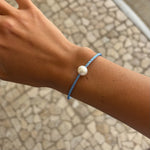 O\pearl bracelet on blue band
