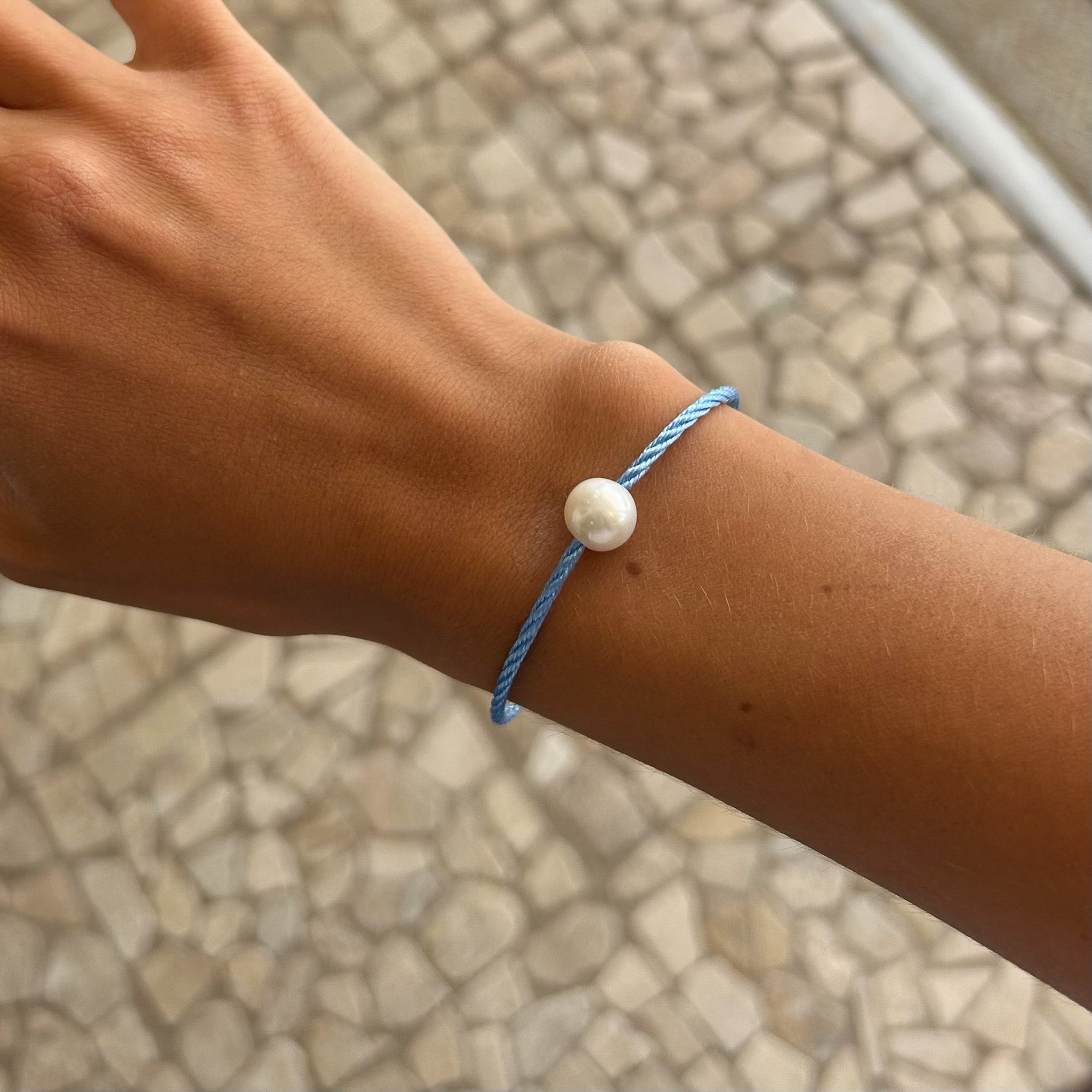 O\pearl bracelet on blue band
