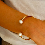Bold gold cuff bracelet with pearl detail