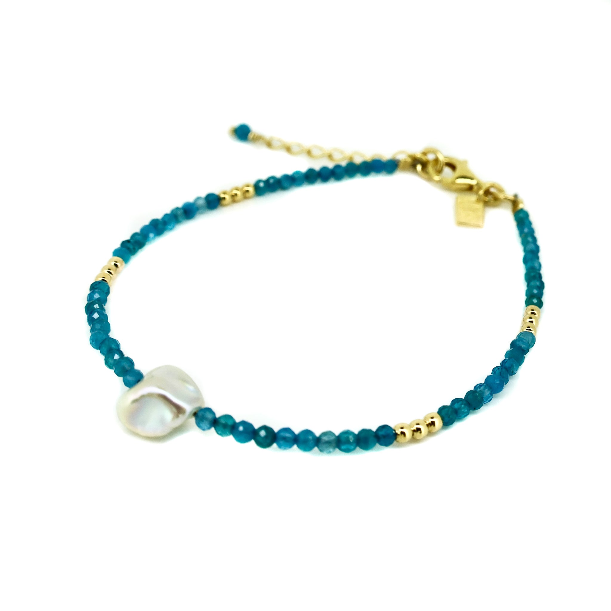 blue beaded bracelet with a freshwater pearl 
