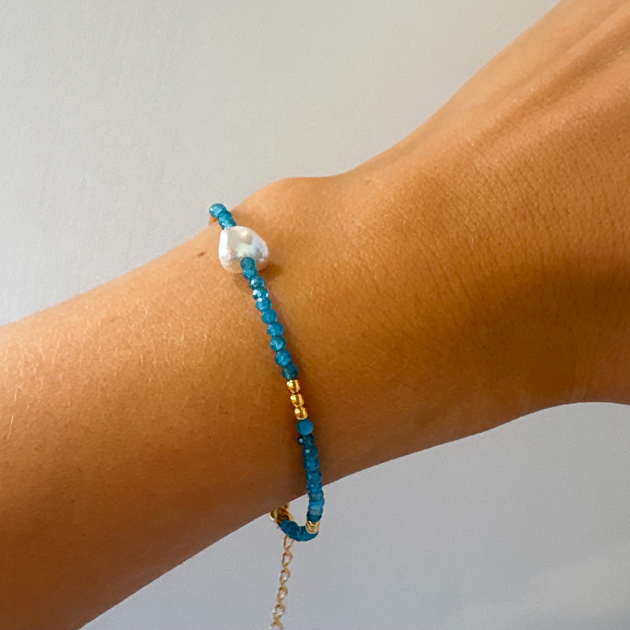 blue beaded bracelet with a keshi pearl & gold clasp