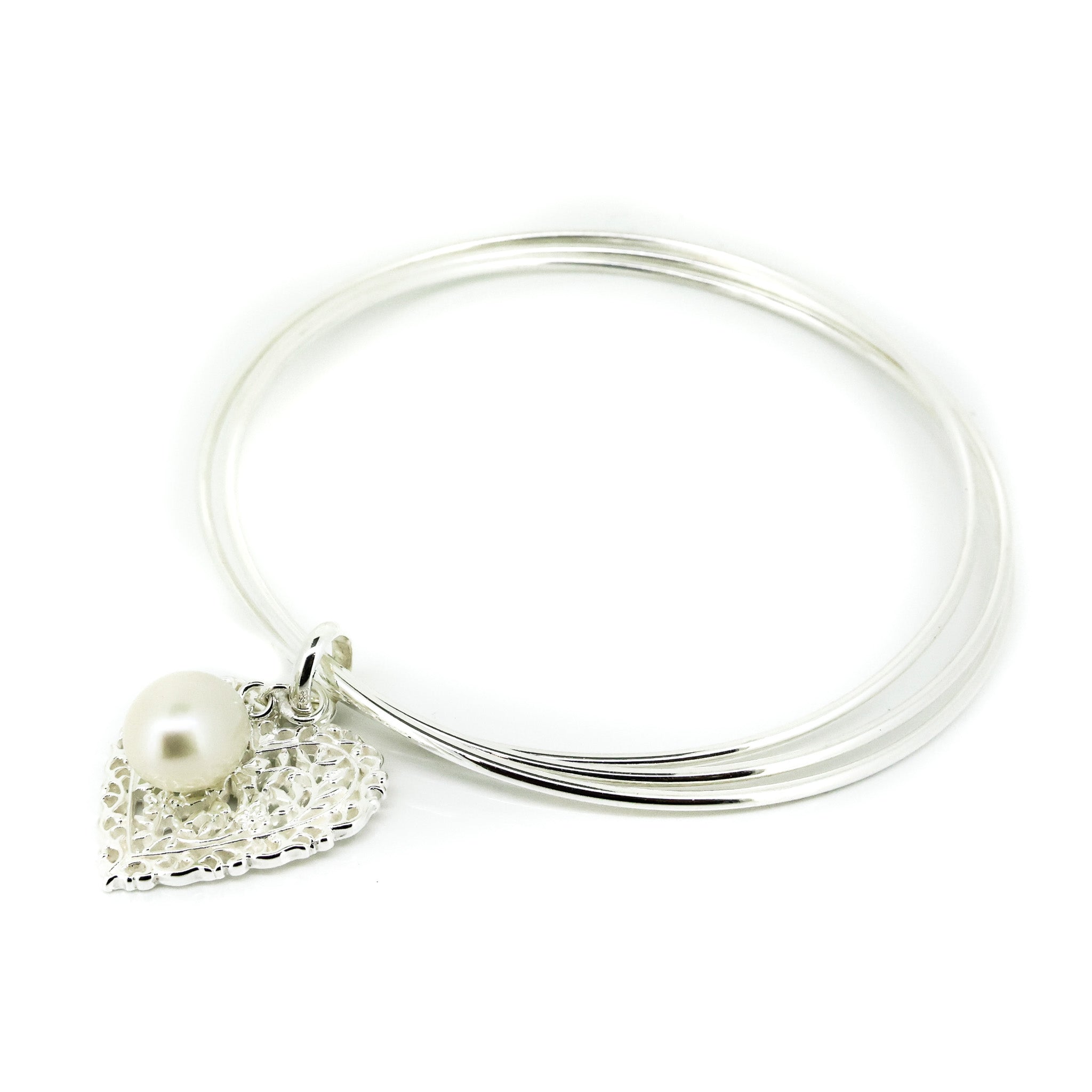 silver bangle with heart and pearl charm