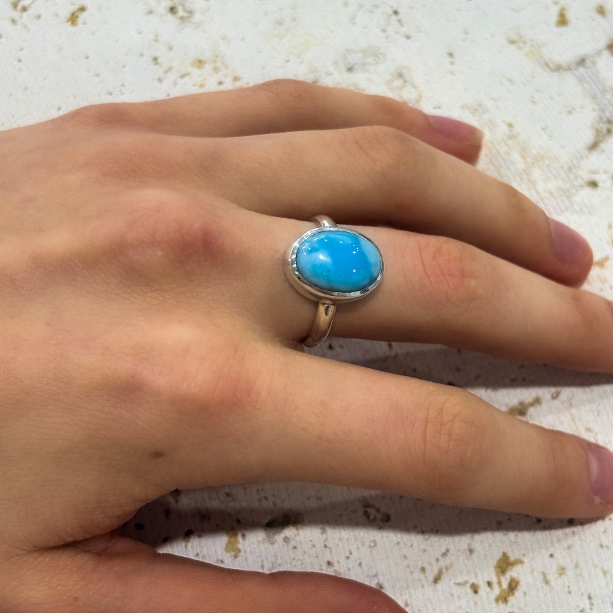 silver oval shaped larimar ring