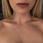dainty pearl pendant set in silver