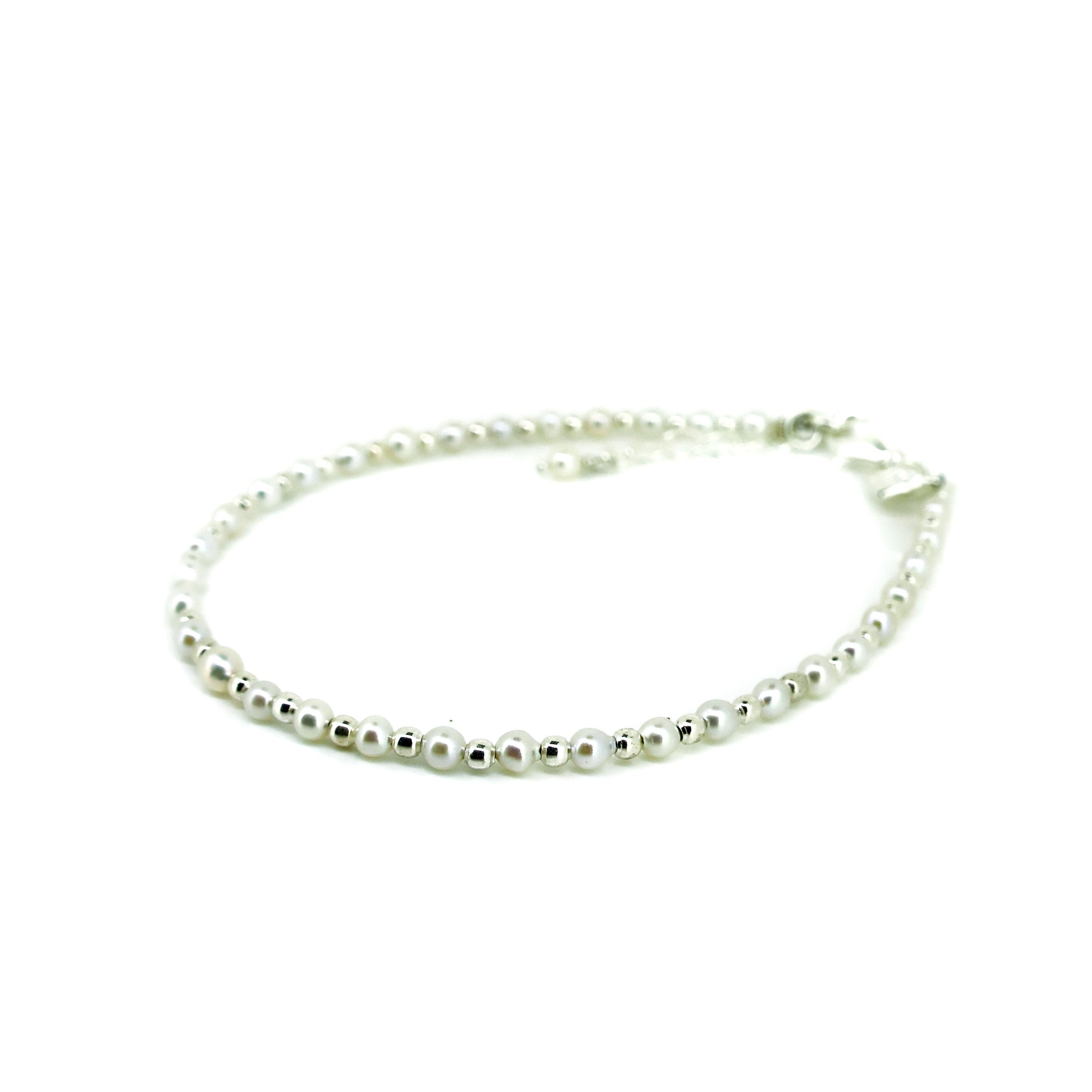 dainty neaded pearl and silver bracelet