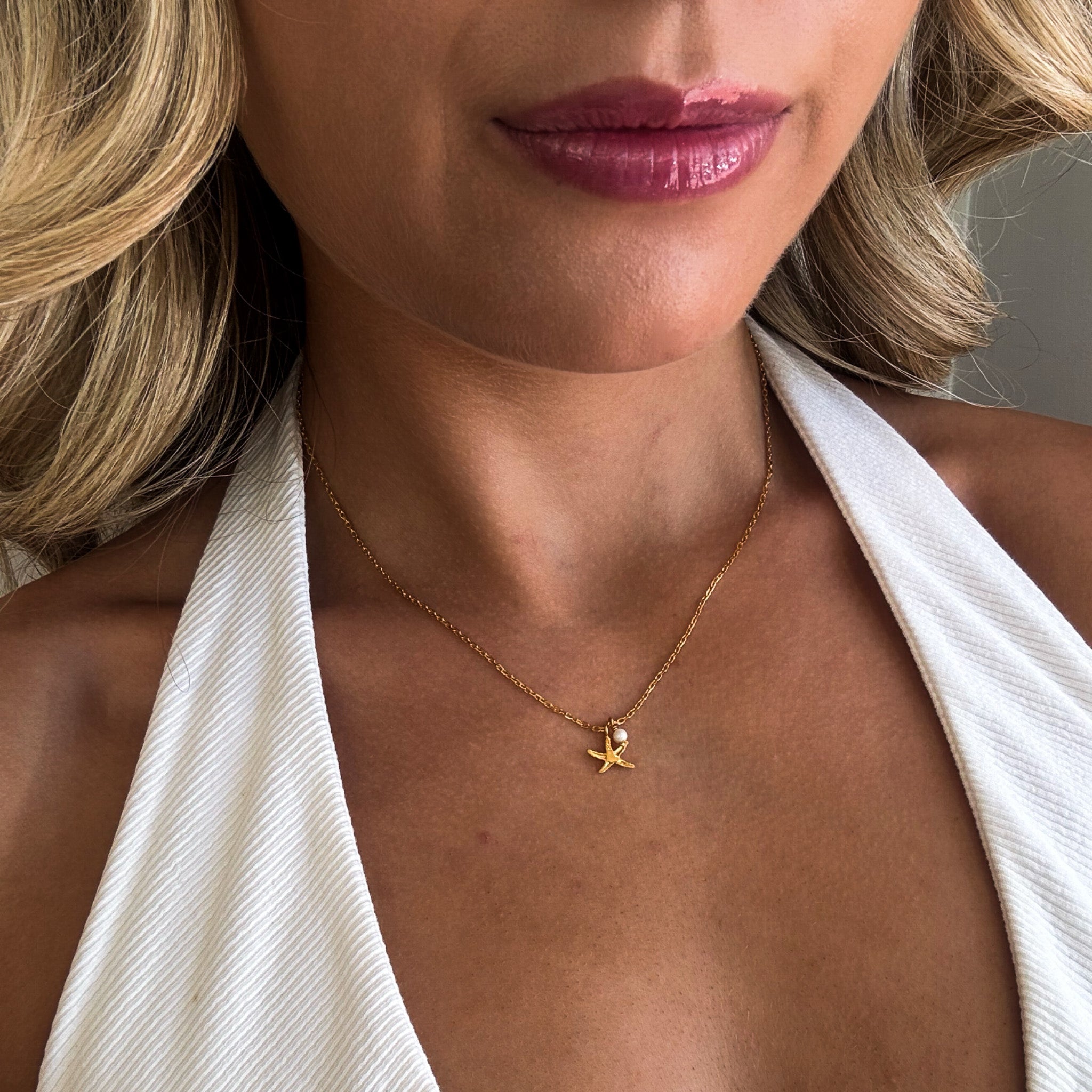 dainty gold starfish necklace with pearl