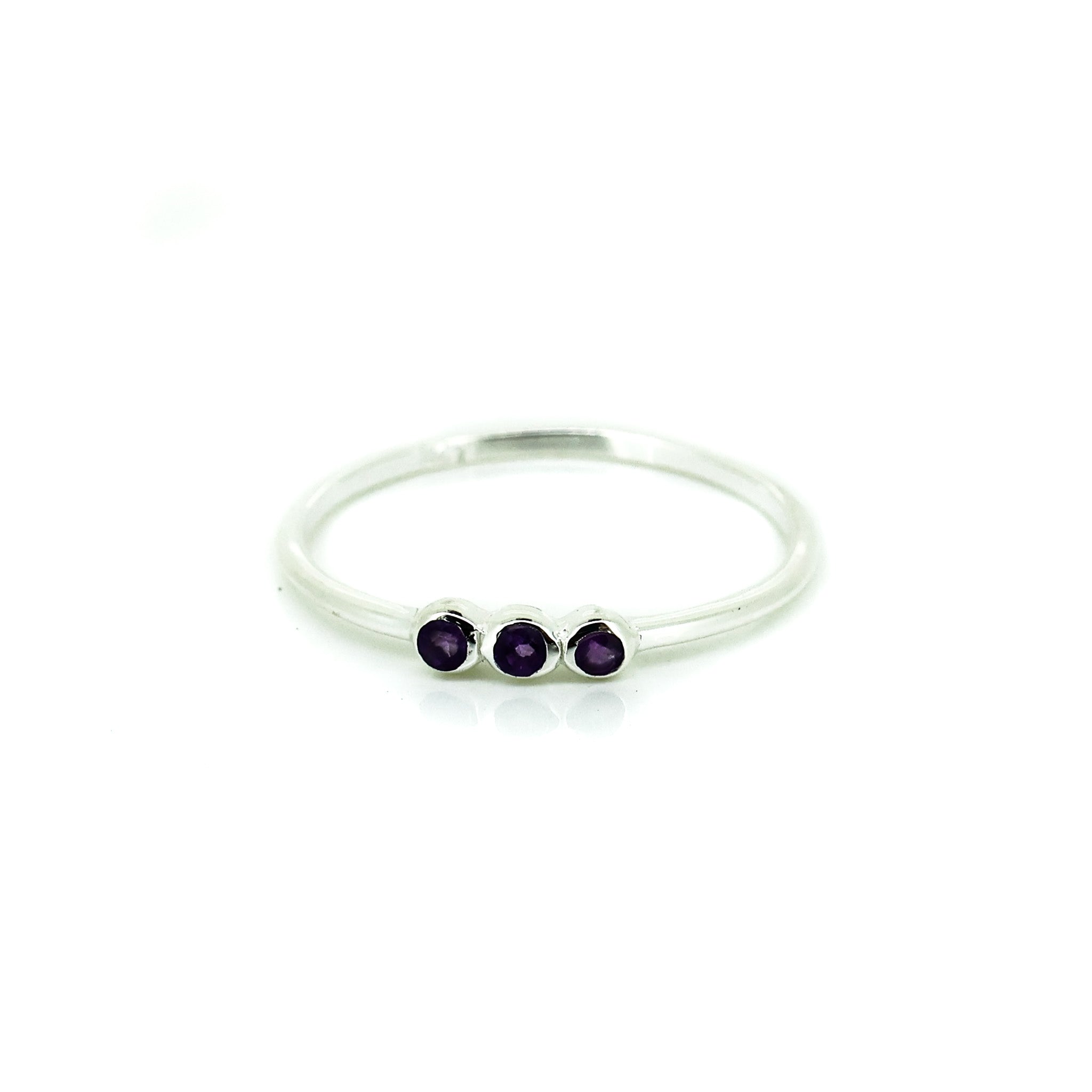 dainty silver ring with amethyst gemstones
