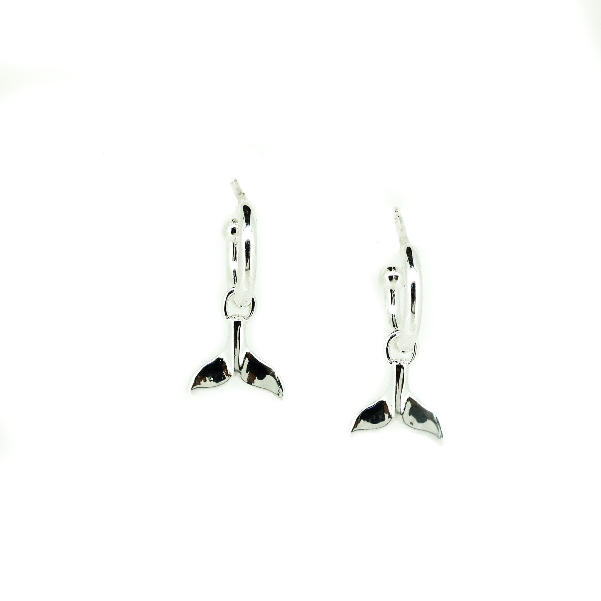 silver huggue earrings with whale tail charm