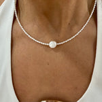dianty pearl necklace with one central freshwater pearl