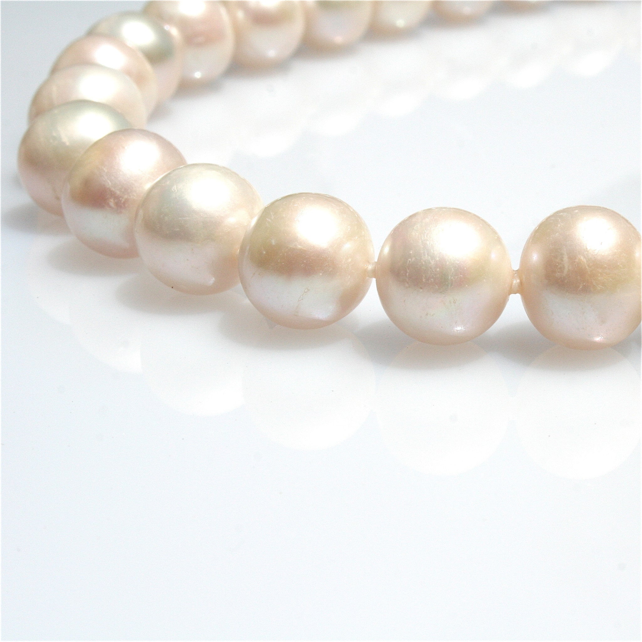 PEARL NECKLACE INDIVIDUALLY HAND KNOTTED ON SILK WITH STERLING SILVER CLASP