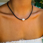 black necklace with pearl