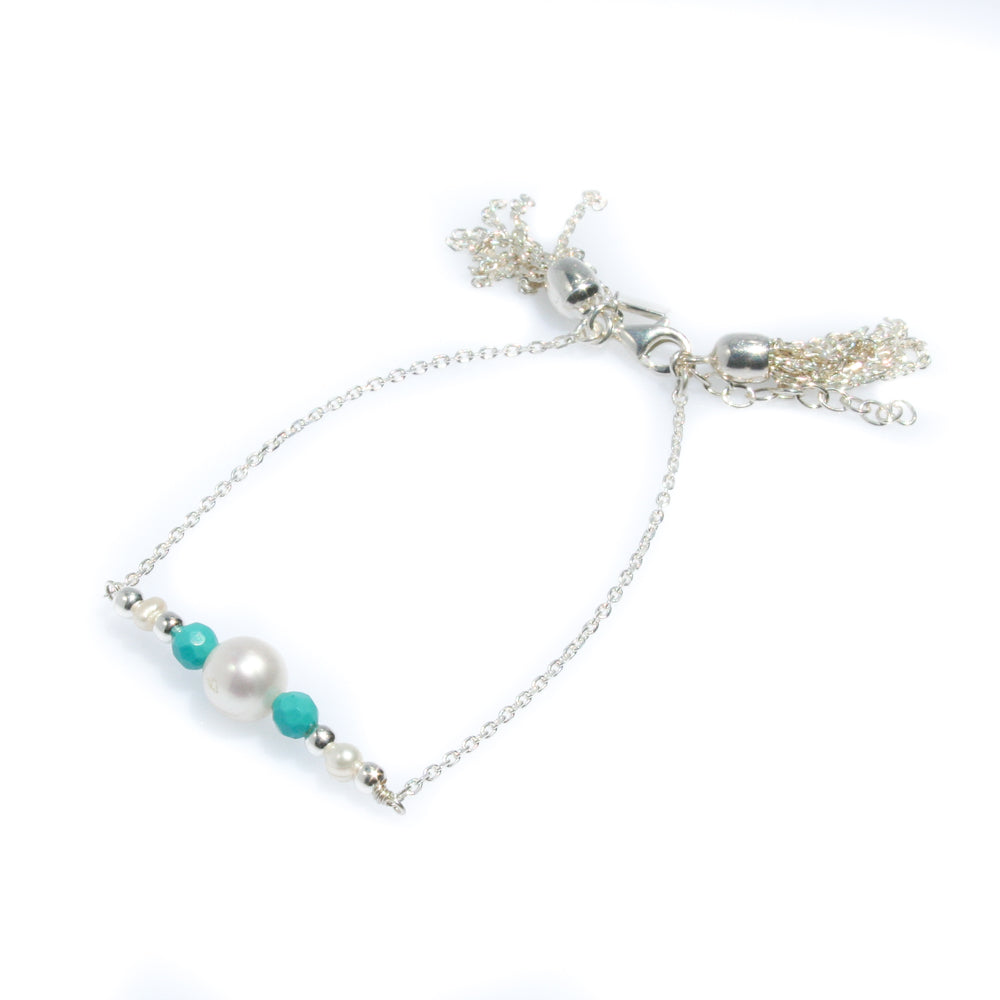 dainty silver pearl tassel bracelet with turquoise detail