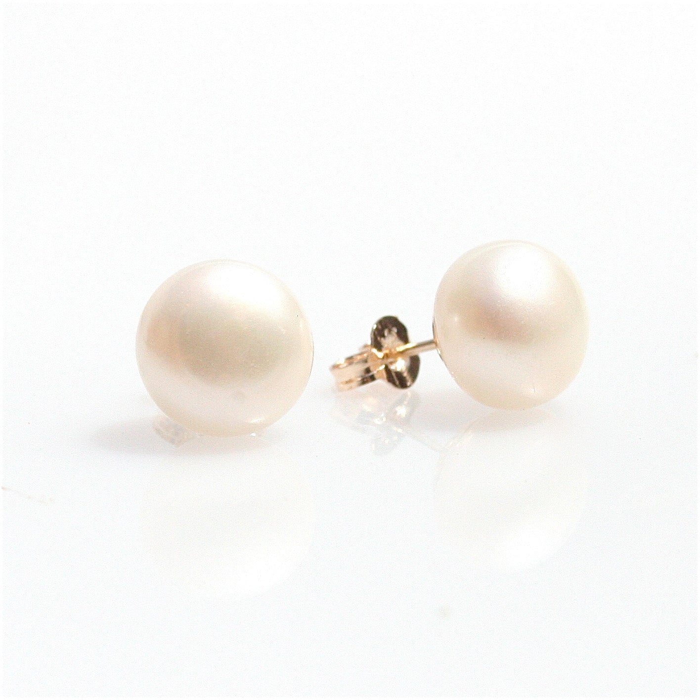 pearl studs in gold