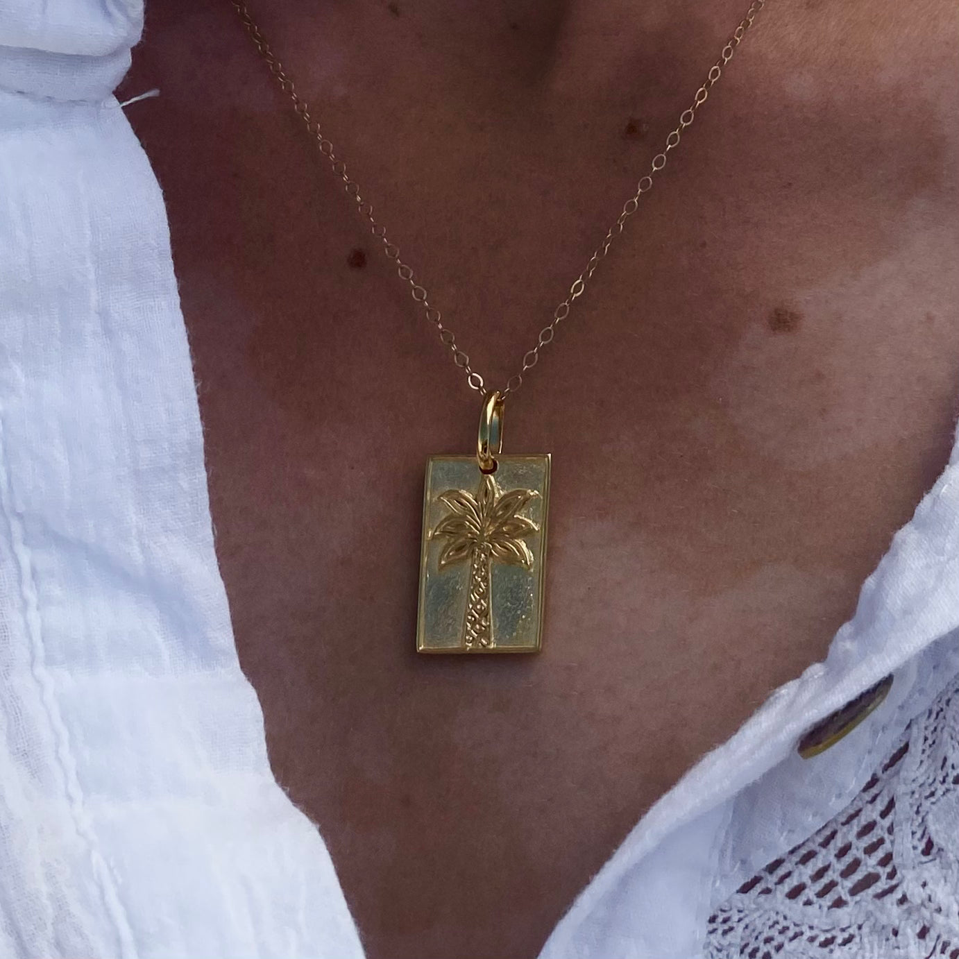 gold palm tree pendant