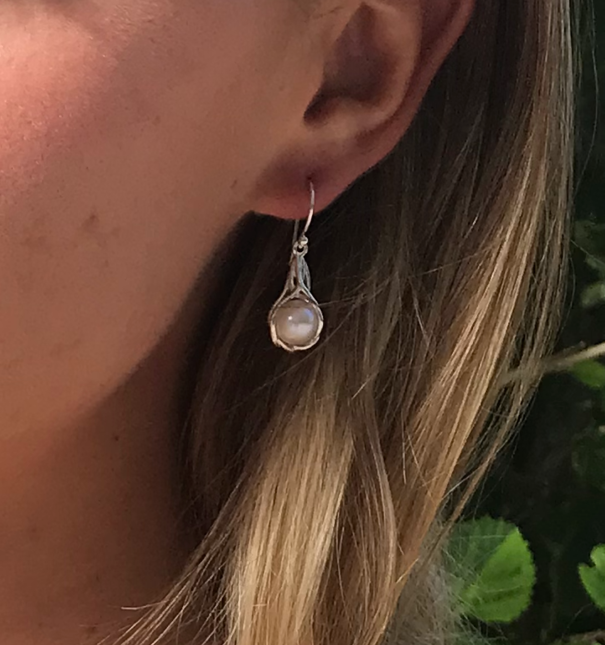 pearl hook earrings encased in silver